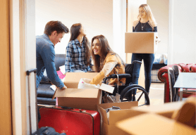 university students unpack boxes