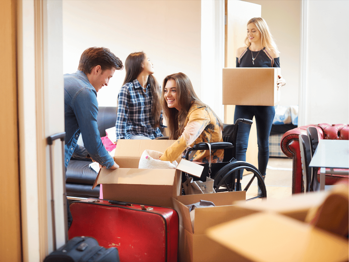 university students unpack boxes