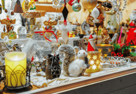 Christmas products are displayed on a market stall