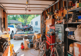 An open garage full of possessions including bicycles